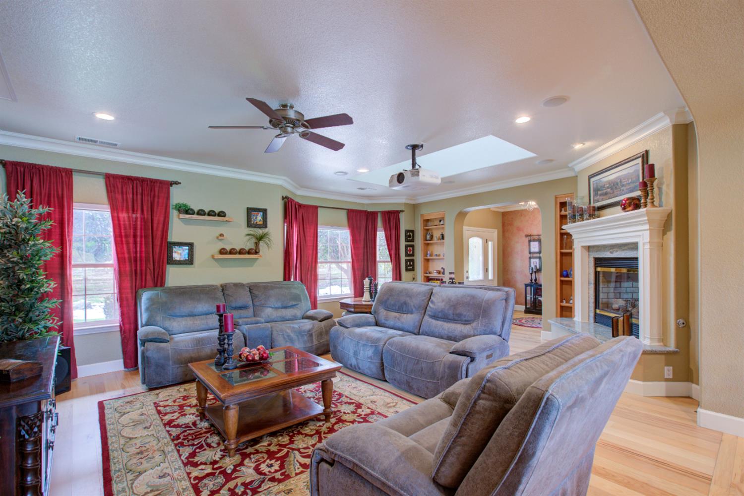 1054 Townhill Road Oakdale, CA 95361 - Photo 17 of 60 a living room with furniture and a fireplace