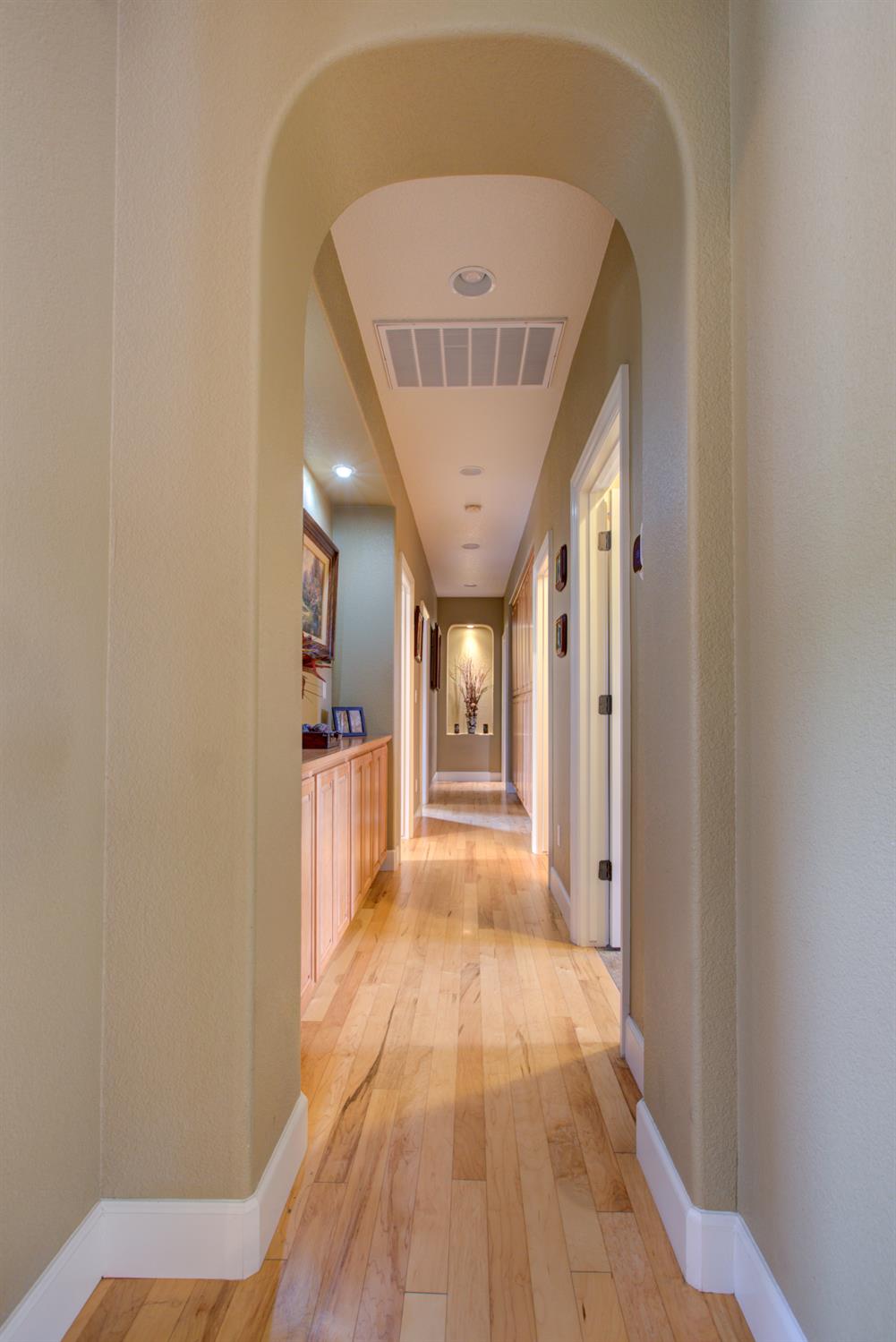 1054 Townhill Road Oakdale, CA 95361 - Photo 18 of 60 a view of a hallway with wooden floor and staircase
