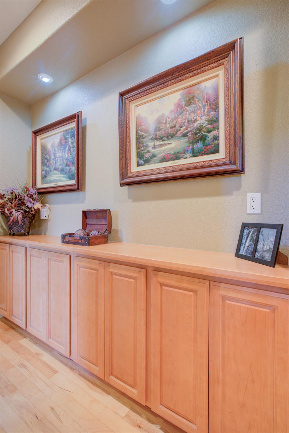 1054 Townhill Road Oakdale, CA 95361 - Photo 21 of 60 a white cabinets a sink and a painting on the wall