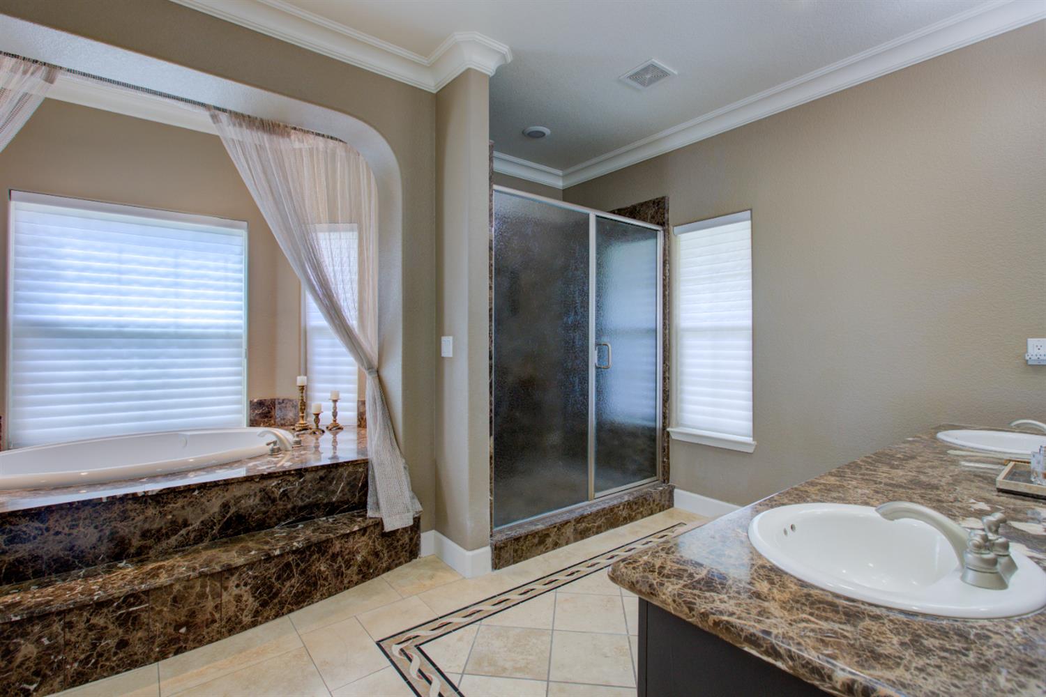 1054 Townhill Road Oakdale, CA 95361 - Photo 31 of 60 a bathroom with a granite countertop sink and a mirror