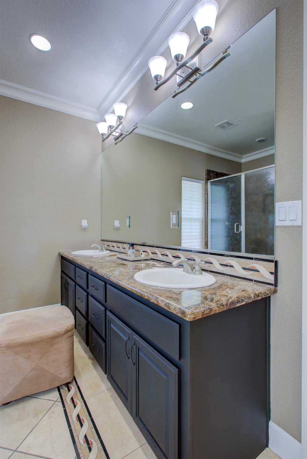 1054 Townhill Road Oakdale, CA 95361 - Photo 33 of 60 a bathroom with a granite countertop sink a toilet and a mirror