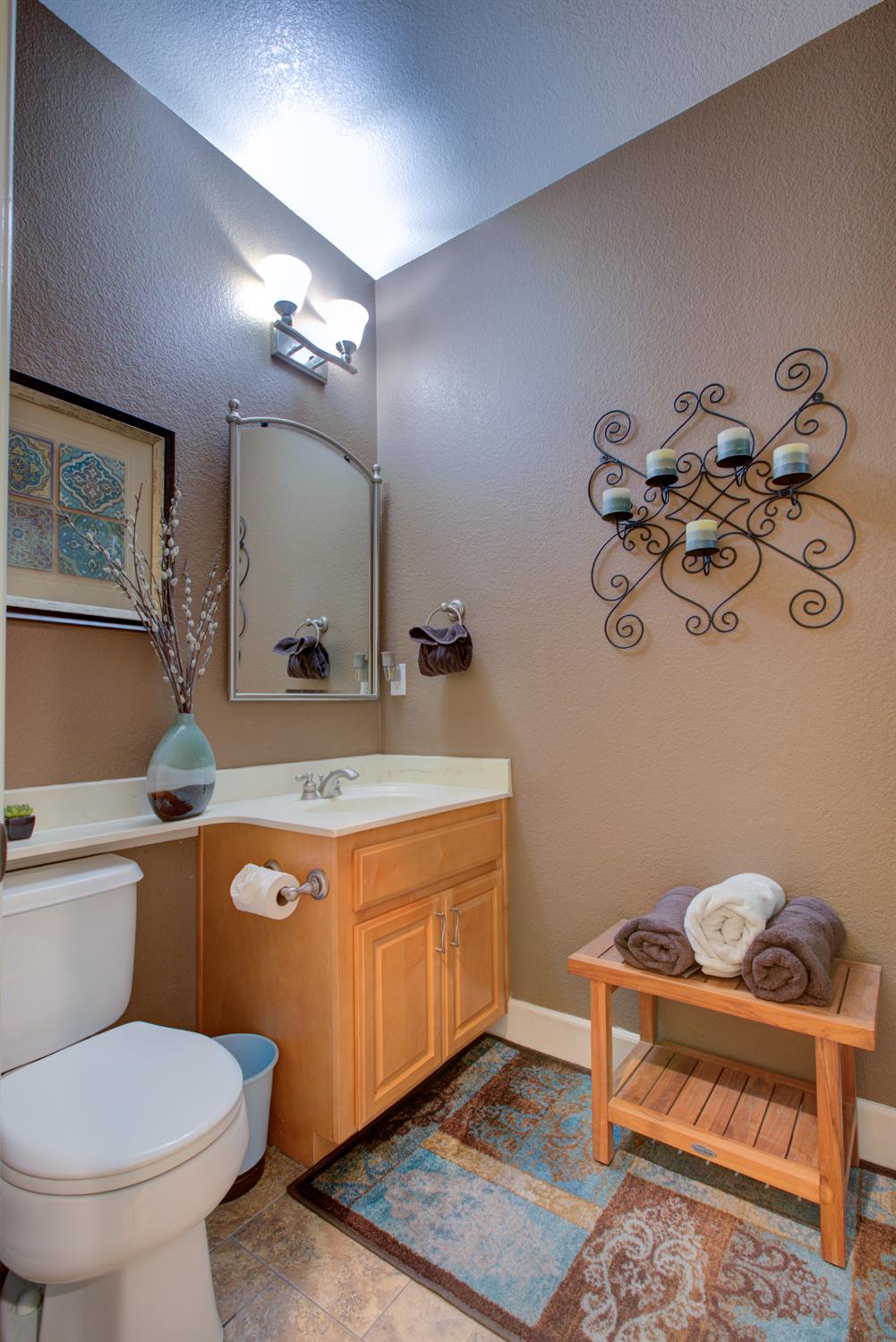 1054 Townhill Road Oakdale, CA 95361 - Photo 39 of 60 a bathroom with a sink mirror vanity and toilet