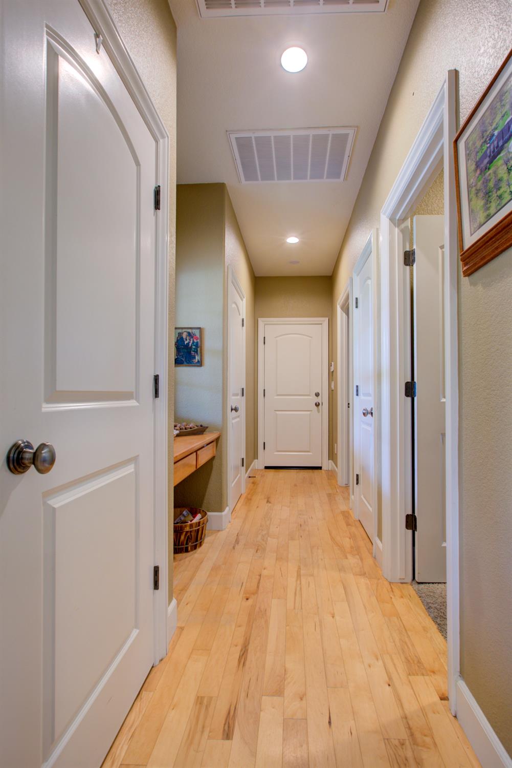 1054 Townhill Road Oakdale, CA 95361 - Photo 40 of 60 wooden floor in a hall with an entryway and a hallway