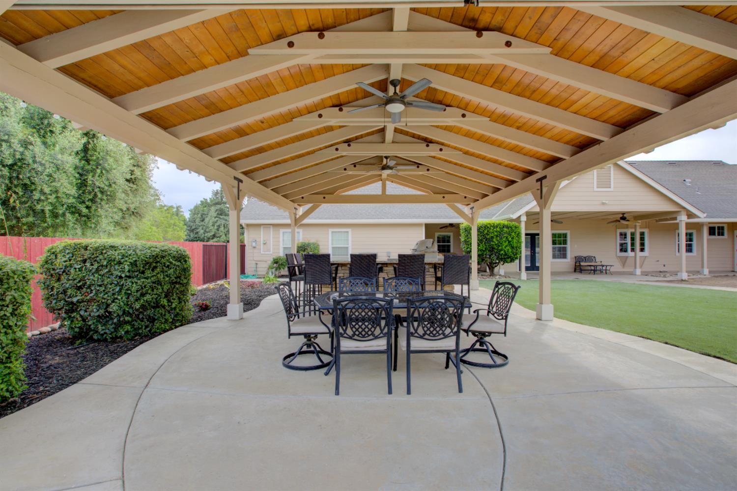 1054 Townhill Road Oakdale, CA 95361 - Photo 45 of 60 a view of a patio with table and chairs potted plants with palm trees