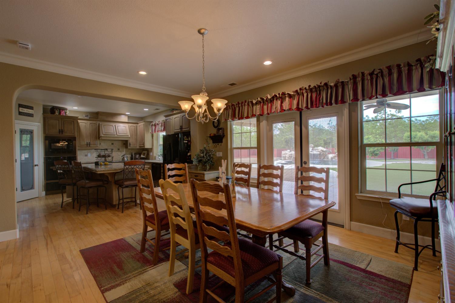1054 Townhill Road Oakdale, CA 95361 - Photo 5 of 60 a view of a dining room with furniture window and wooden floor