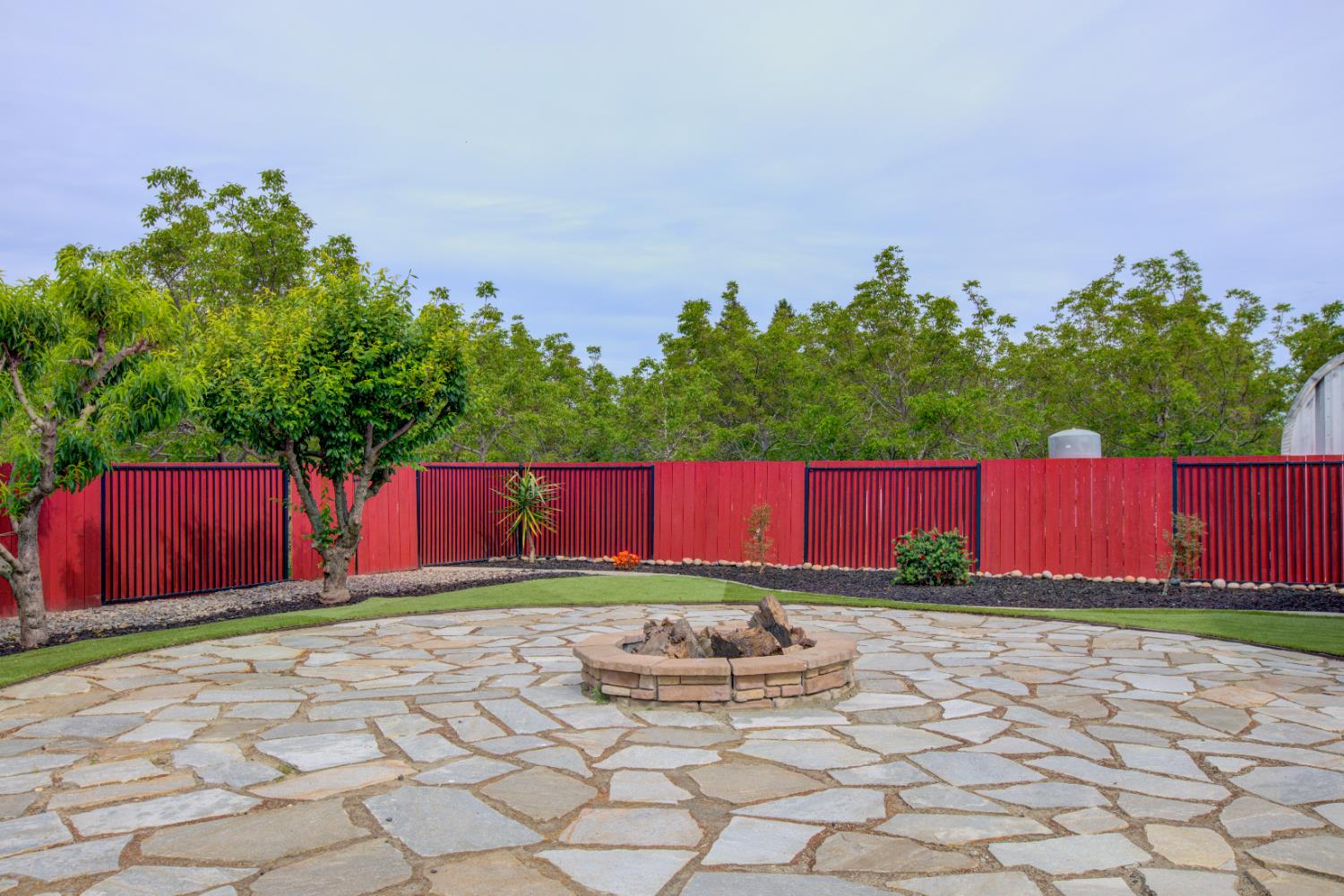 1054 Townhill Road Oakdale, CA 95361 - Photo 51 of 60 a view of backyard with potted plants and wooden fence
