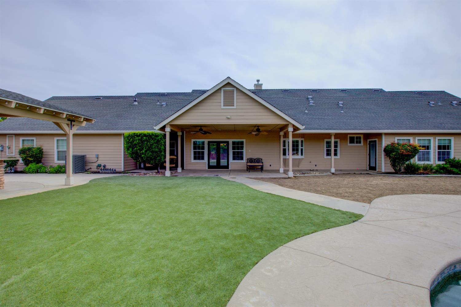 1054 Townhill Road Oakdale, CA 95361 - Photo 53 of 60 a front view of a house with a yard and trees