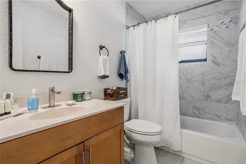 a bathroom with a sink a toilet and a bathtub