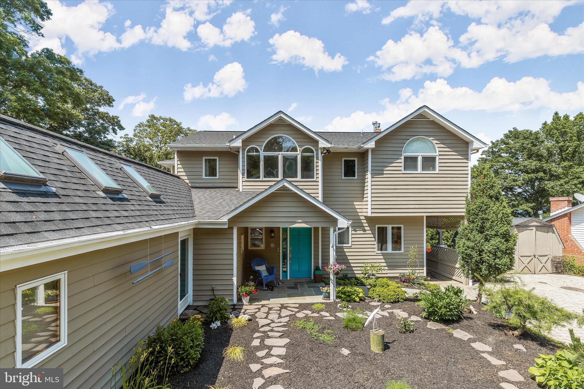 330 South Riverside Drive Crownsville, MD 21032 - Photo 113 of 137 a front view of a house with a yard and garage