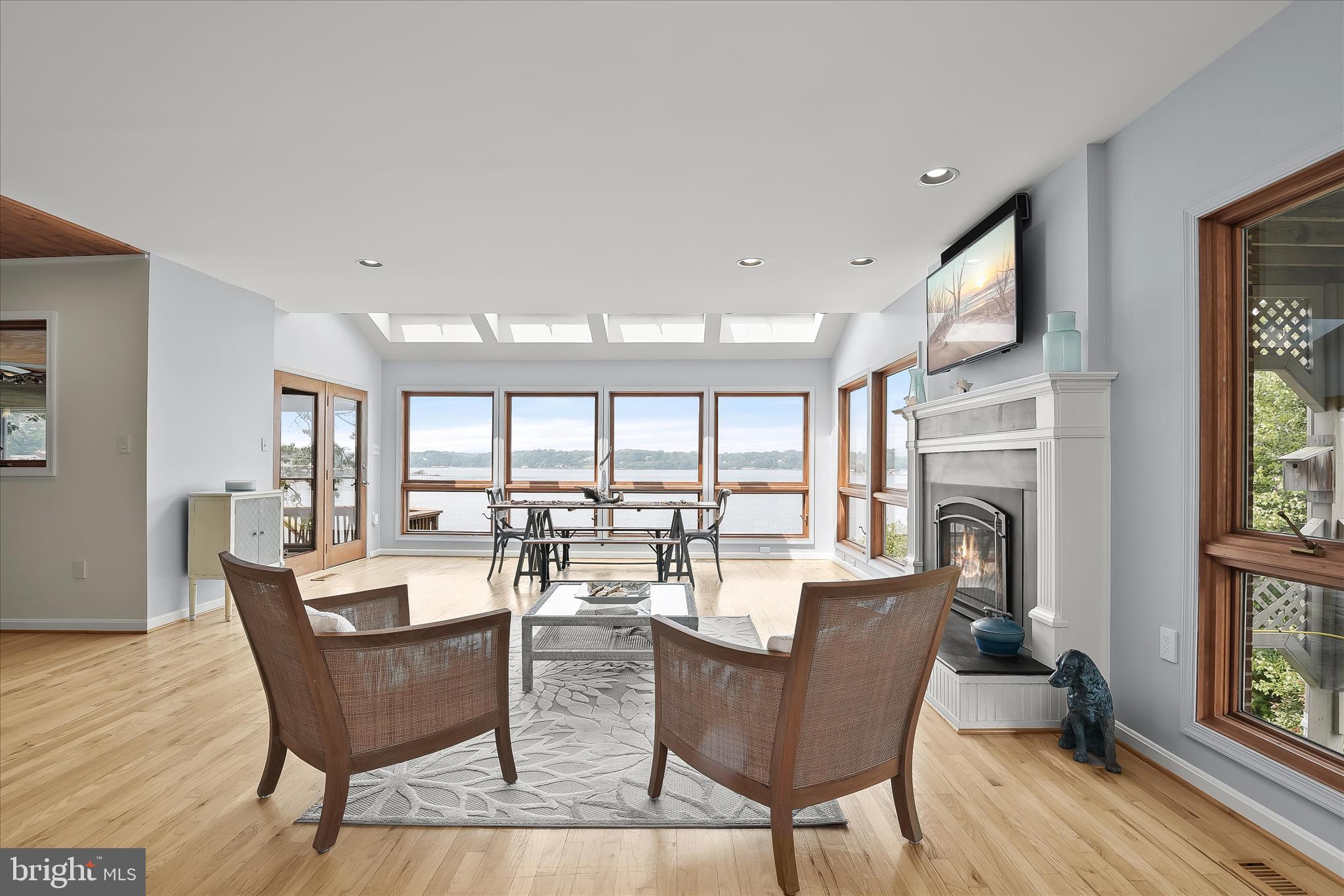 330 South Riverside Drive Crownsville, MD 21032 - Photo 17 of 137 a dining room with furniture a fireplace and wooden floor