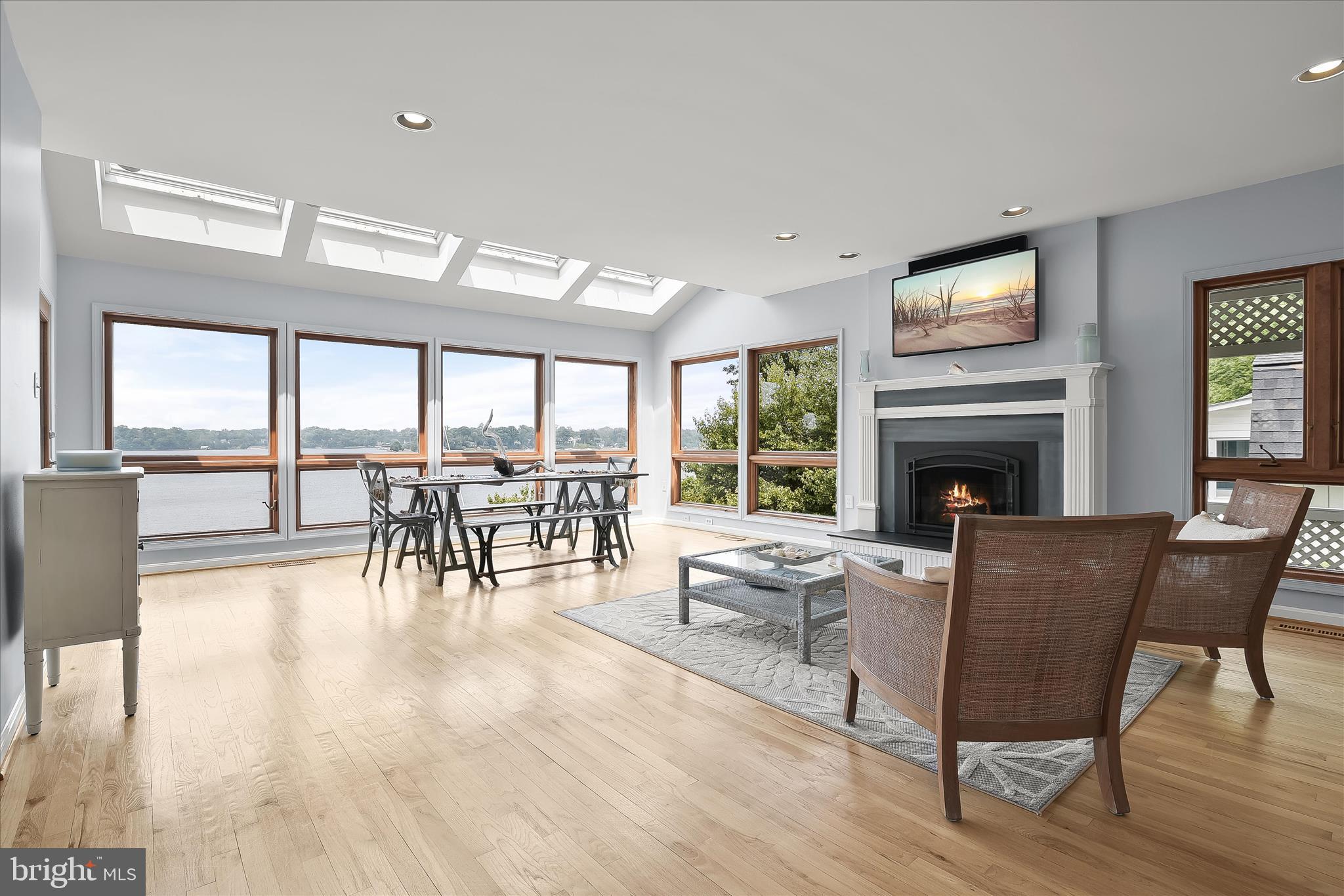 330 South Riverside Drive Crownsville, MD 21032 - Photo 28 of 137 a living room with furniture a fireplace and a large window