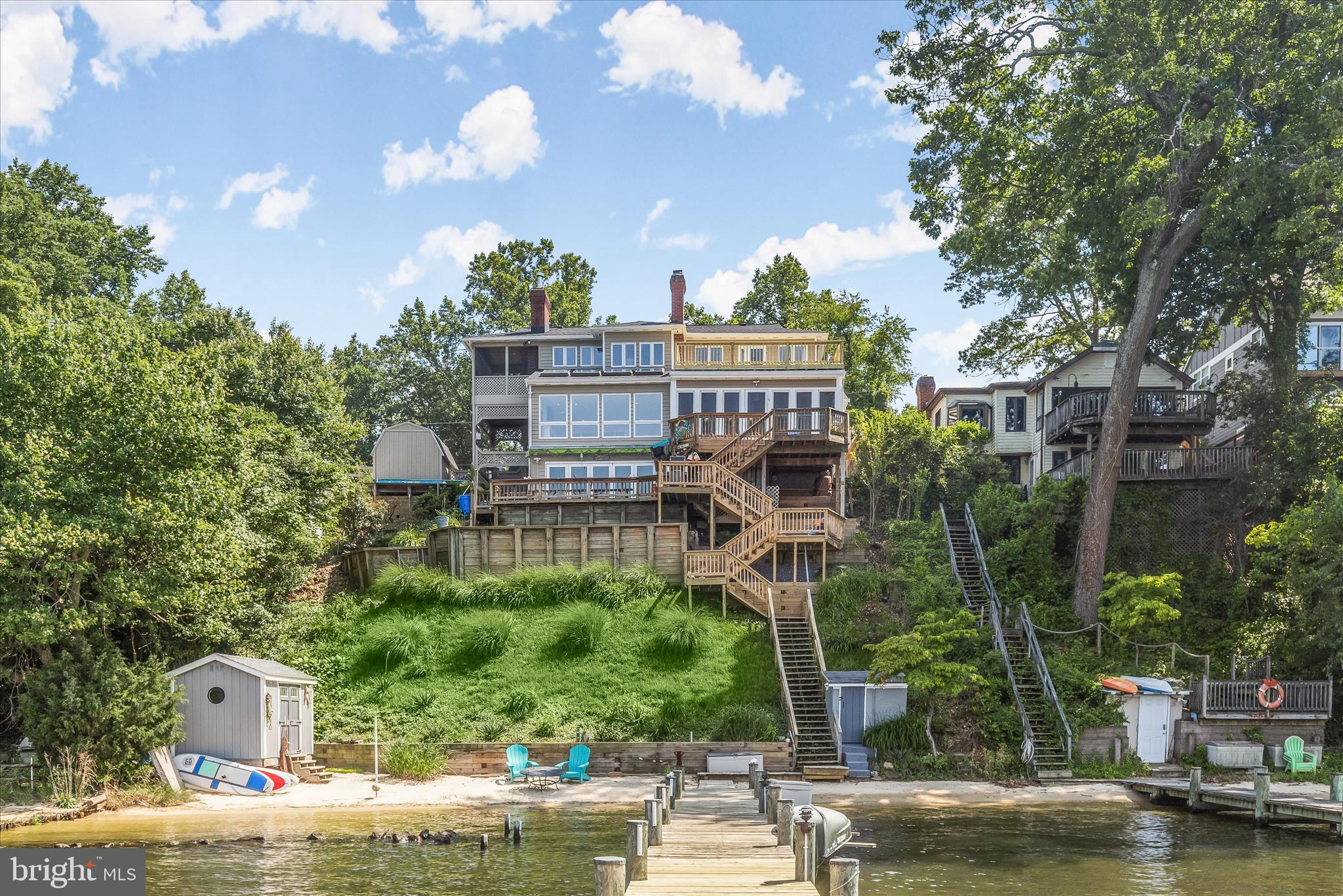 330 South Riverside Drive Crownsville, MD 21032 - Photo 3 of 137 a view of a swimming pool with a patio and plants