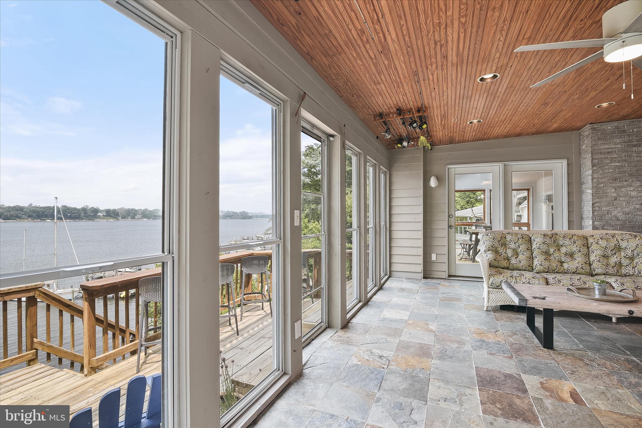 330 South Riverside Drive Crownsville, MD 21032 - Photo 33 of 137 a view of a porch with furniture and a roof