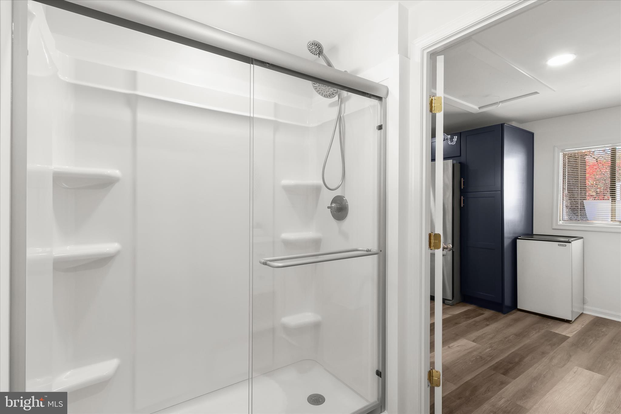 330 South Riverside Drive Crownsville, MD 21032 - Photo 51 of 137 a bathroom with a glass shower door