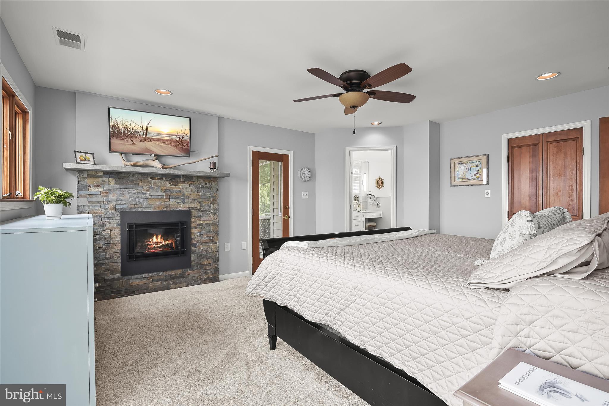 330 South Riverside Drive Crownsville, MD 21032 - Photo 55 of 137 a bedroom with a bed and a fireplace