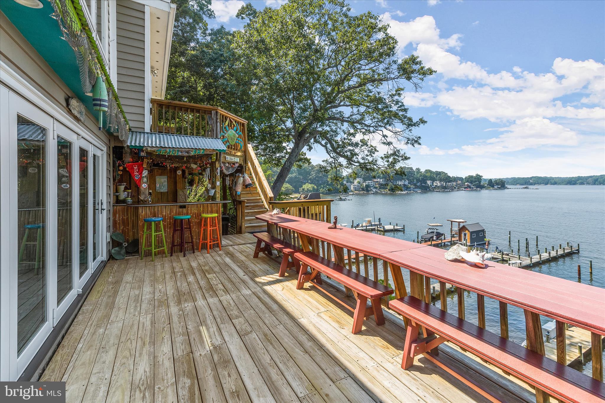 330 South Riverside Drive Crownsville, MD 21032 - Photo 77 of 137 a view of a balcony with wooden floor and lake view