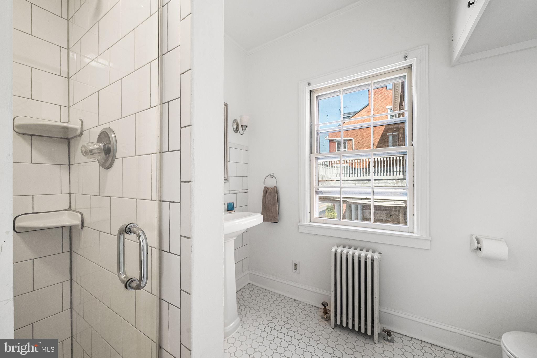 106 North Court Street Frederick, MD 21701 - Photo 20 of 34 a bathroom with a window
