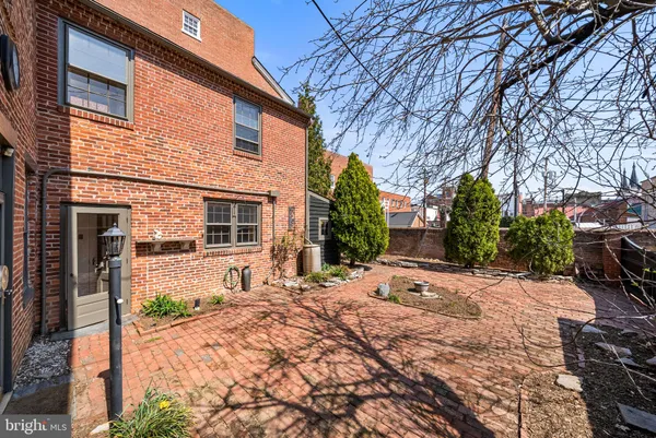 a backyard of a house with yard and seating area