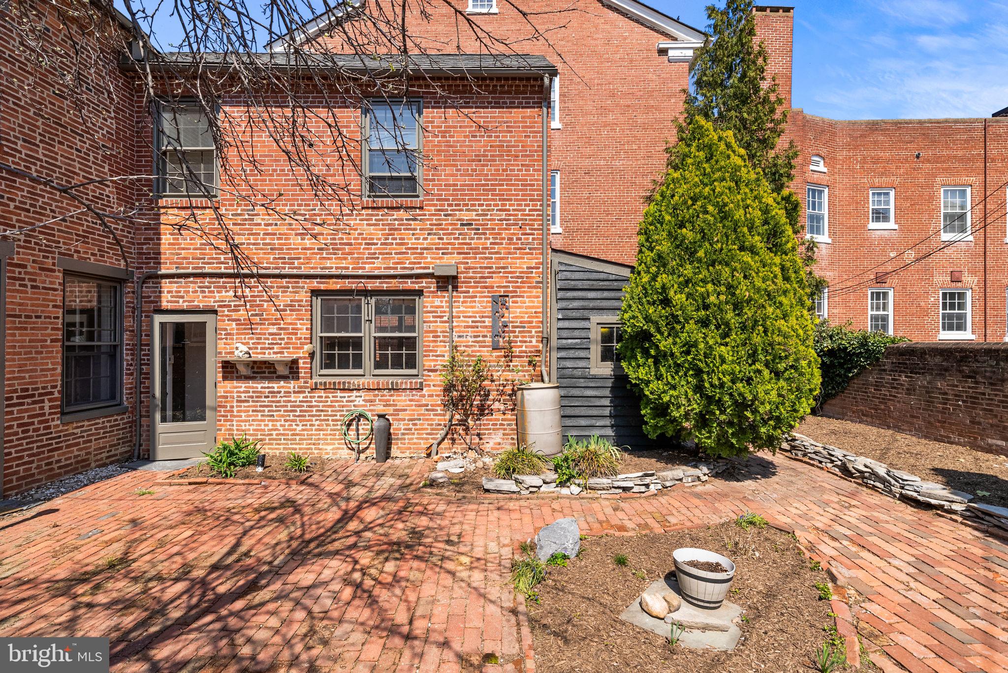 106 North Court Street Frederick, MD 21701 - Photo 26 of 34 a front view of a house with a yard