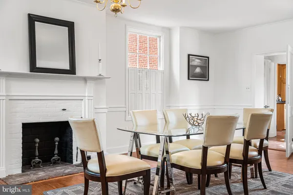a view of a dining room with furniture and a fireplace