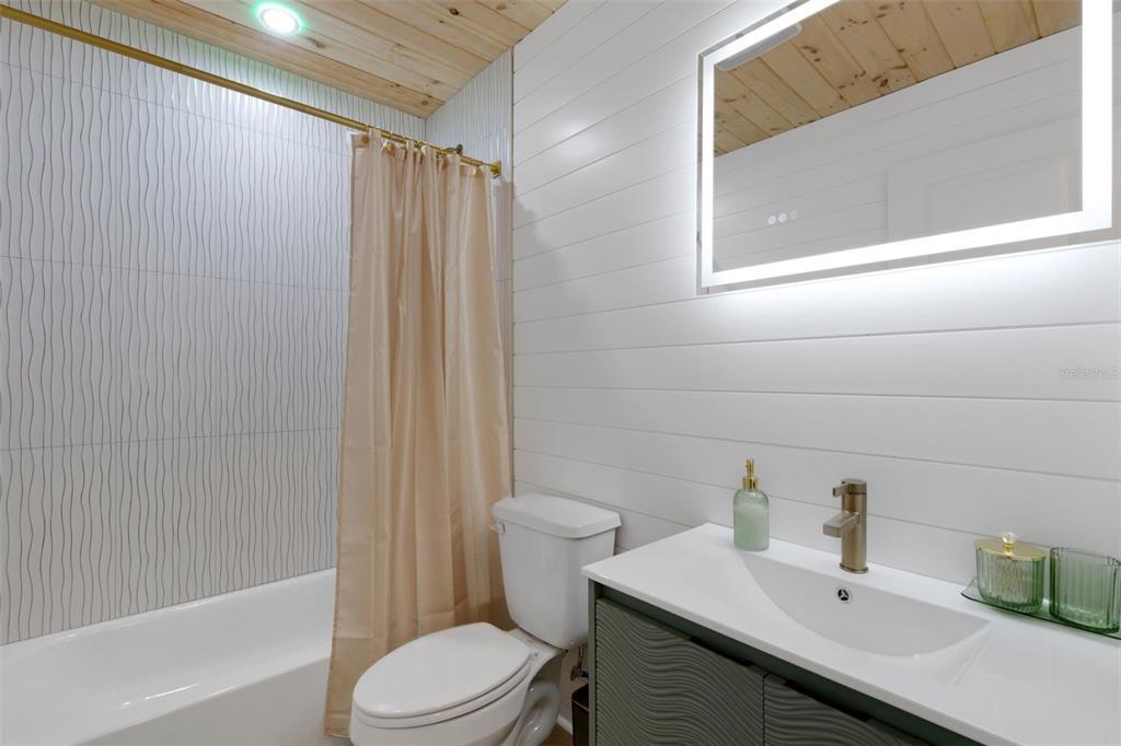 8390 Little Gasparilla Placida, FL 33946 - Photo 23 of 81 a bathroom with a sink a toilet and shower