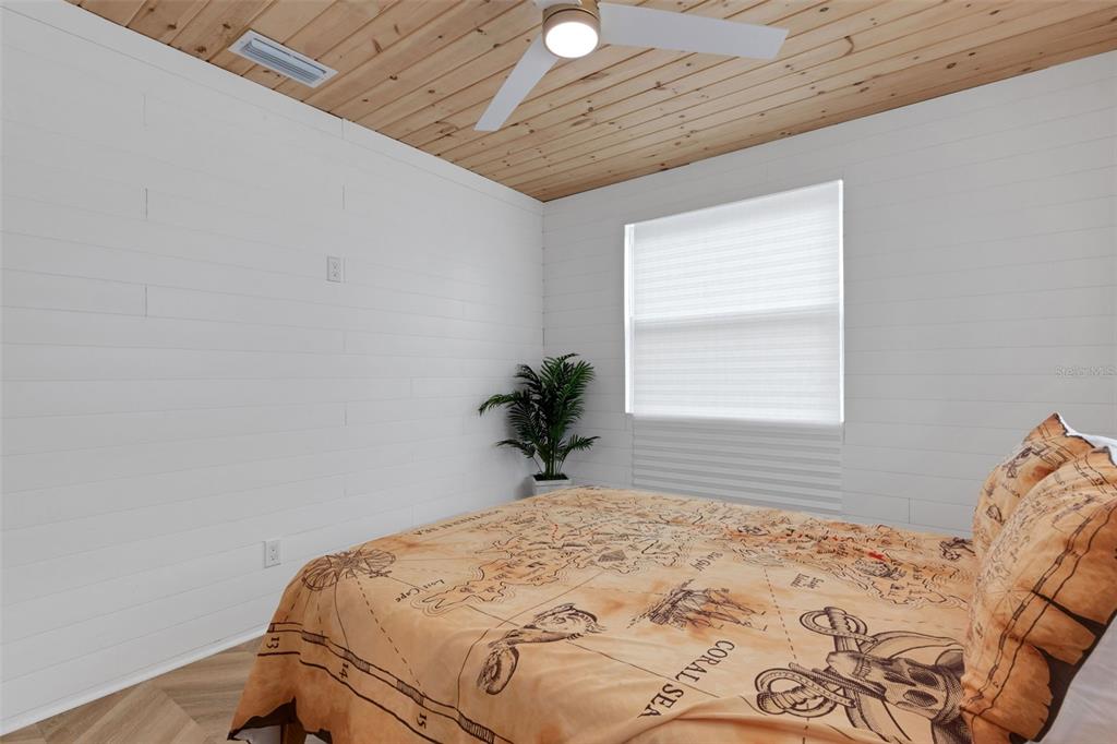 8390 Little Gasparilla Placida, FL 33946 - Photo 27 of 81 a bedroom with a bed and a window