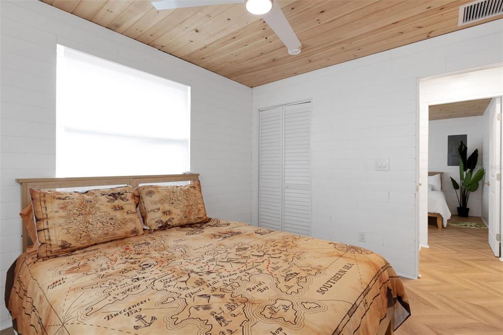 8390 Little Gasparilla Placida, FL 33946 - Photo 28 of 81 a bedroom with a large bed and a window