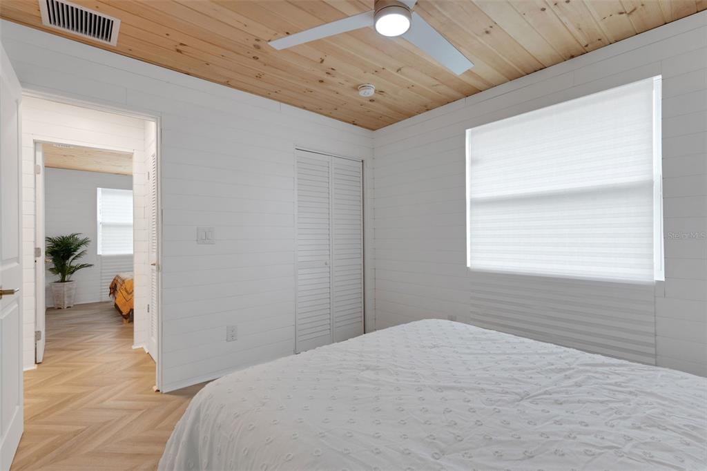 8390 Little Gasparilla Placida, FL 33946 - Photo 34 of 81 a bedroom with a bed and a view of bathroom