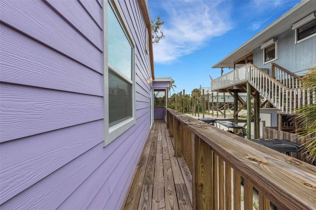 8390 Little Gasparilla Placida, FL 33946 - Photo 42 of 81 a balcony with view of wooden floor