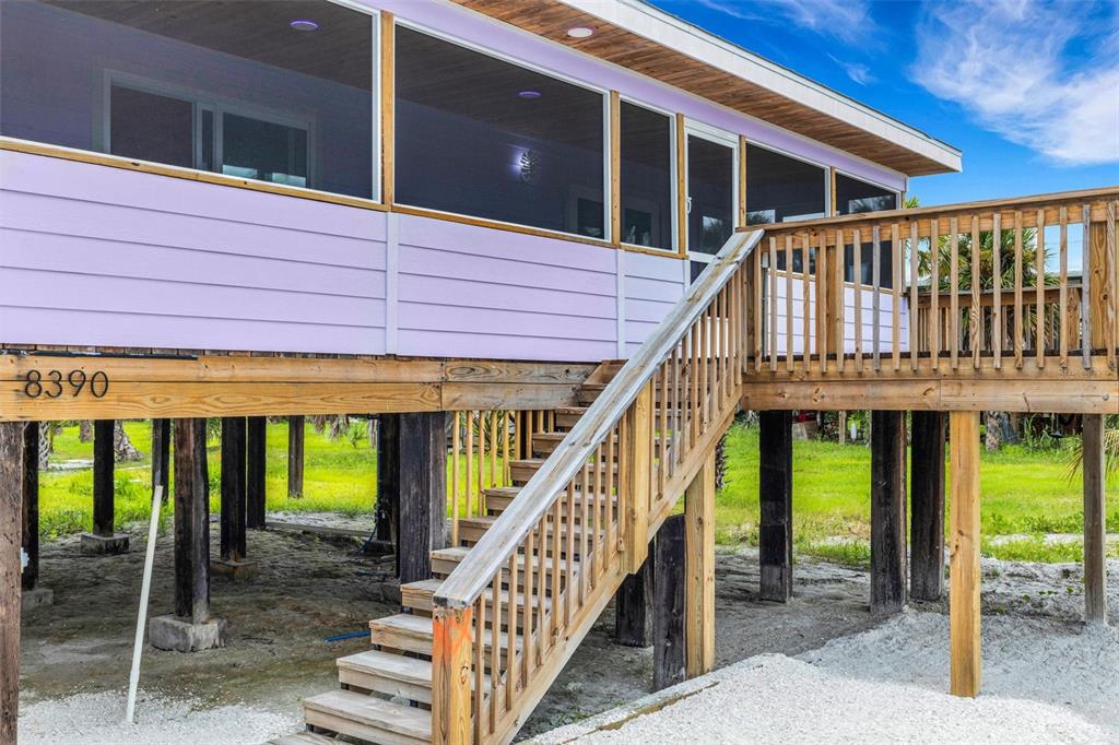 8390 Little Gasparilla Placida, FL 33946 - Photo 51 of 81 a front view of a house with a porch