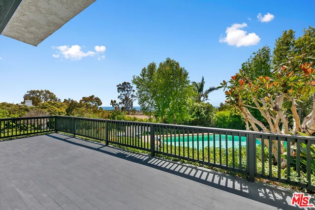 a view of a balcony with staircase