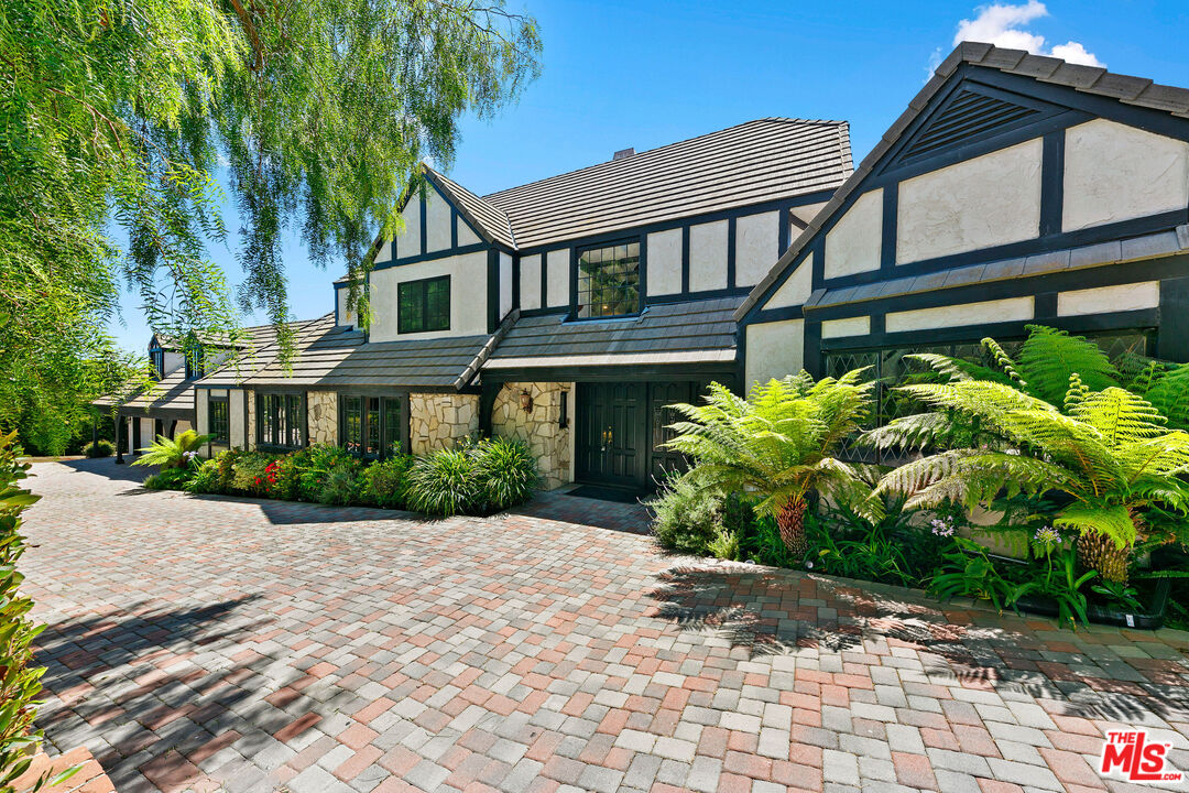 29528 Harvester Road Malibu, CA 90265 - Photo 2 of 36 a front view of a house with garden