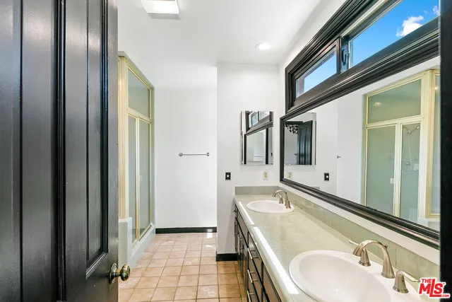 a bathroom with a tub and a shower