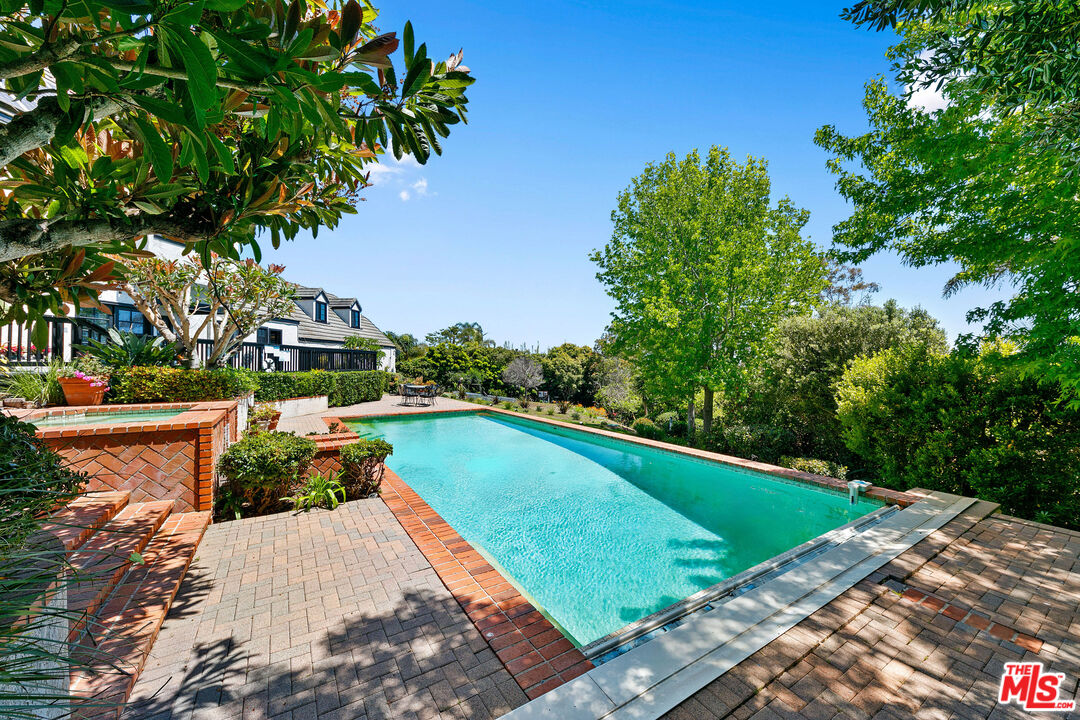 29528 Harvester Road Malibu, CA 90265 - Photo 4 of 36 a view of a swimming pool and lounge chair