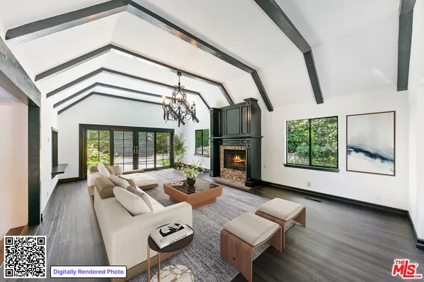 a view of an empty room with wooden floor fireplace and a window