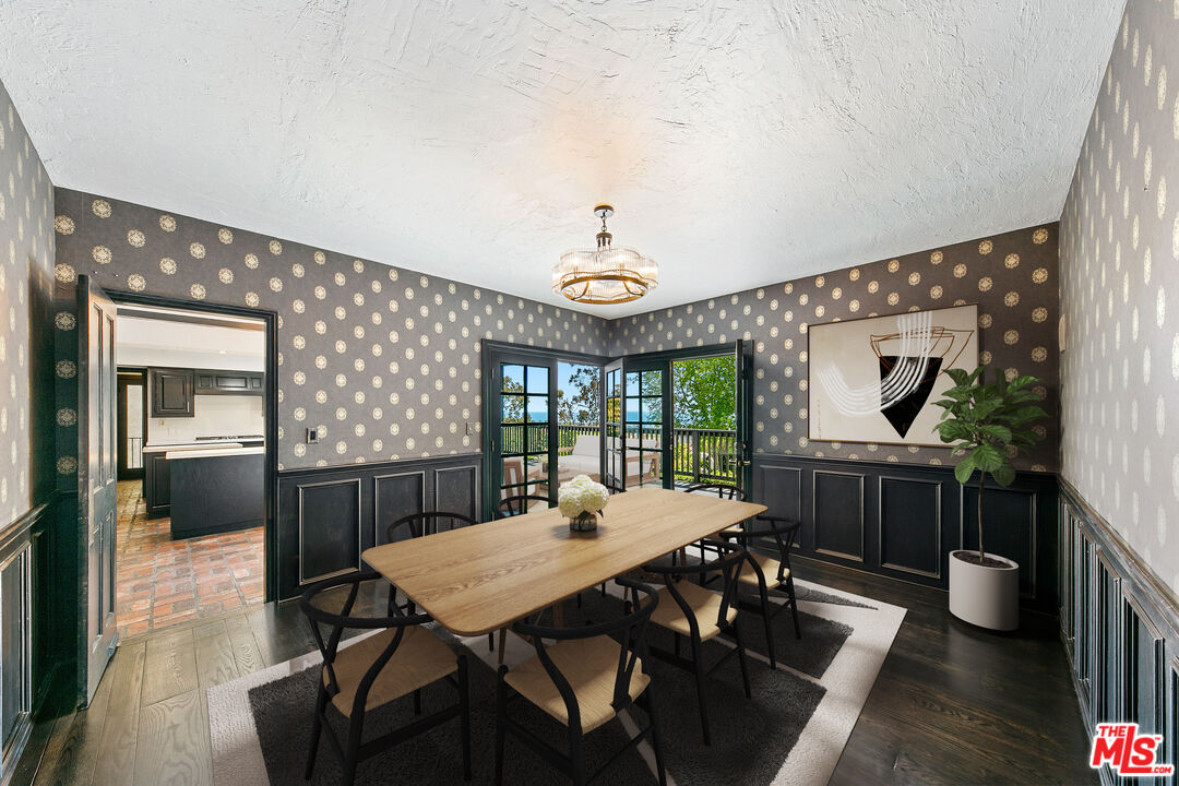 29528 Harvester Road Malibu, CA 90265 - Photo 5 of 36 a view of a dining room with furniture window and wooden floor