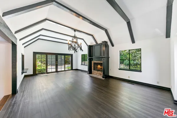 a view of a swimming pool and lounge chair