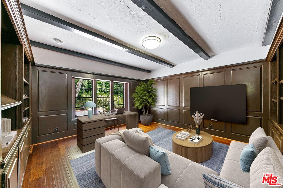 29528 Harvester Road Malibu, CA 90265 - Photo 7 of 36 a living room with furniture and a flat screen tv