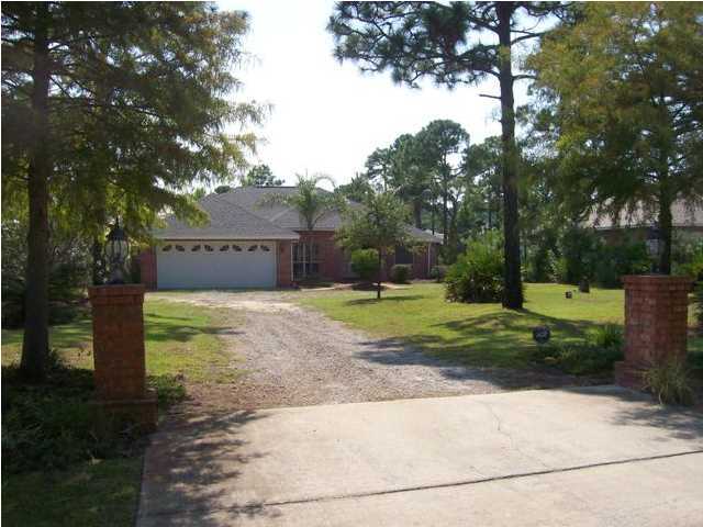 1364 Driftwood Point Road Santa Rosa Beach, FL 32459 - Photo 1 of 32 a view of a house with a big yard plants and large trees