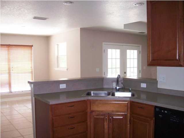 1364 Driftwood Point Road Santa Rosa Beach, FL 32459 - Photo 18 of 32 a kitchen with a sink cabinets and window