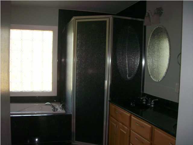 1364 Driftwood Point Road Santa Rosa Beach, FL 32459 - Photo 21 of 32 a bathroom with a sink and a mirror