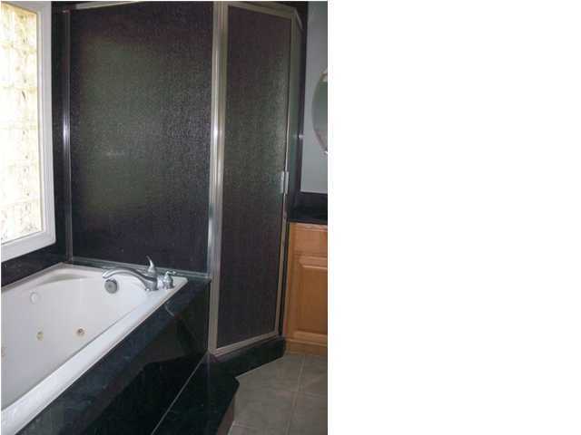 1364 Driftwood Point Road Santa Rosa Beach, FL 32459 - Photo 23 of 32 a bathroom with a tub and sink