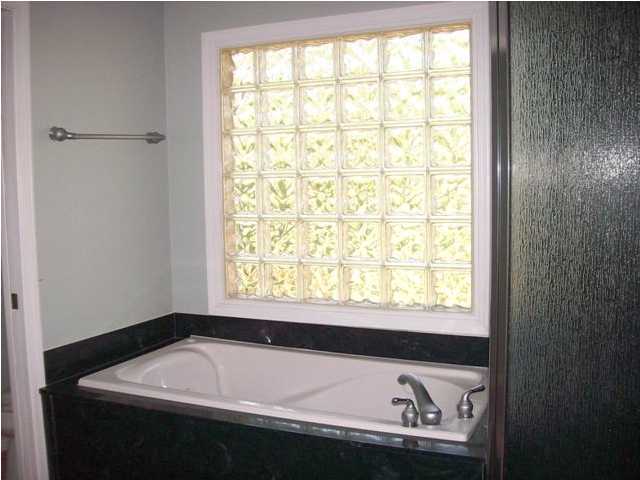 1364 Driftwood Point Road Santa Rosa Beach, FL 32459 - Photo 25 of 32 a bathroom with a bathtub and next to a window