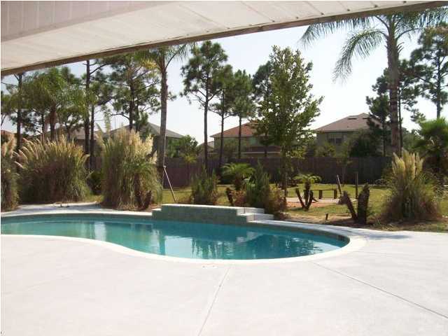 1364 Driftwood Point Road Santa Rosa Beach, FL 32459 - Photo 30 of 32 a view of a swimming pool with a yard