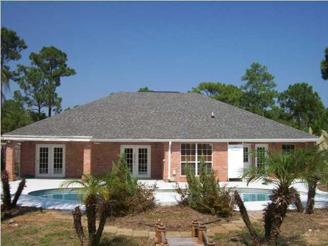 1364 Driftwood Point Road Santa Rosa Beach, FL 32459 - Photo 31 of 32 a front view of a house with garden