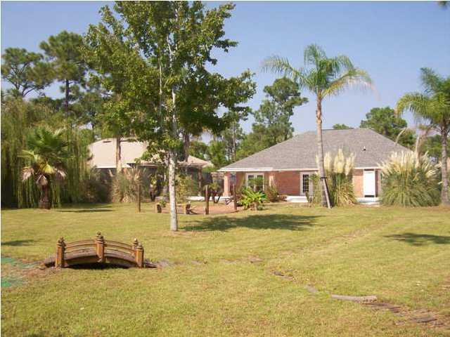 1364 Driftwood Point Road Santa Rosa Beach, FL 32459 - Photo 32 of 32 a view of a house with a yard