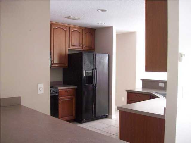 1364 Driftwood Point Road Santa Rosa Beach, FL 32459 - Photo 6 of 32 a kitchen with stainless steel appliances granite countertop a refrigerator and a stove