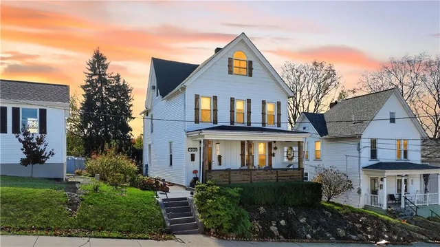 front view of a house with a yard