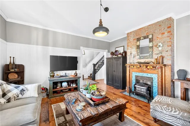 a living room with furniture fireplace and flat screen tv