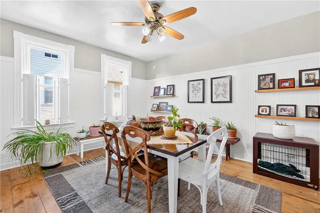 a dining room with furniture and a painting